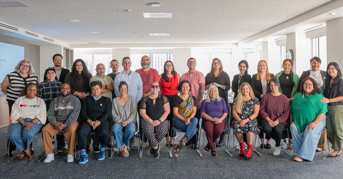A group of individuals gather for a photo at the Inatai office Seattle. 